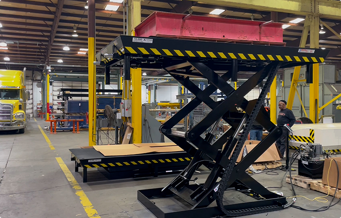 Autoquip high-capacity scissor lift in a manufacturing facility