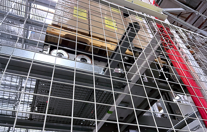 Warehouse ASRS integration with a custom Autoquip lift system